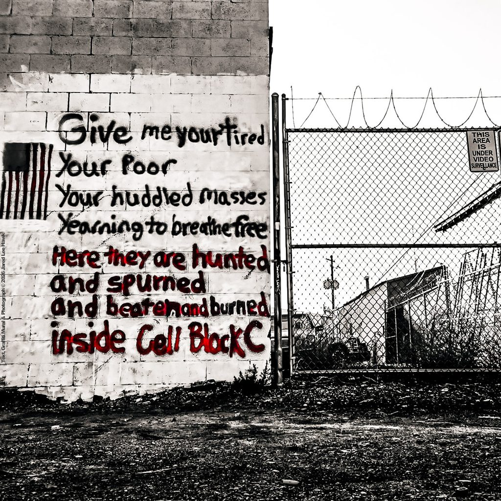 "Cell Block C" by Jared Hawk. Original poetic material, graffiti artwork, and photograph by Jared Hawk, created September 13, 2026, at the Legal Graffiti Wall, Railroad Ave, Twin Falls, Idaho 83301, United States. Text as painted:
Give me your tired
Your Poor
Your huddled masses
Yearning to breathe free
Here they are hunted
and spurned
and beaten and burned
Inside Cell Block C
First stanza quotes Emma Lazarus, "The New Colossus" (1883). Created September 13, 2026, at the Legal Graffiti Wall, Railroad Ave, Twin Falls, ID 83301, United States. First stanza quotes Emma Lazarus,
"The New Colossus" (1883).
Copyright 2026 Jared Hawk. All rights reserved in the photograph, graffiti artwork, composition, and original poetic material. First stanza from Emma Lazarus, "The New Colossus" (1883), public domain.